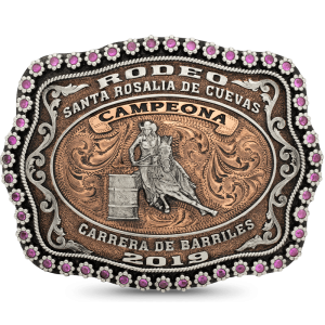 A custom rodeo belt buckle trophy for women featuring silver lettering for Carrera de Barriles Rodeo Champion, featuring a barrel racing cowgirl figure 